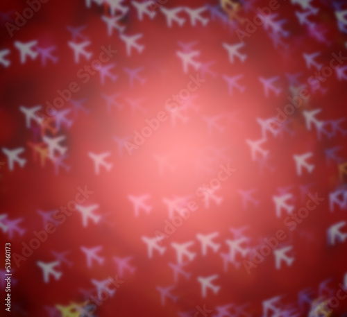 defocused airplane or aircraft  bokeh on red vignette for transport or travel background and blur focus