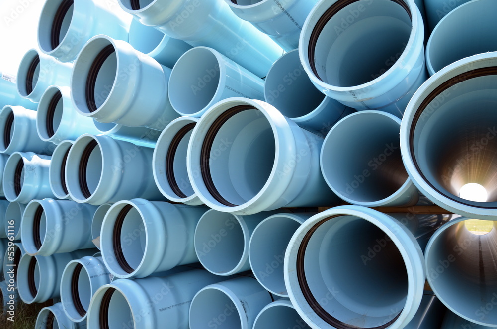 Stacks of blue PVC water pipes