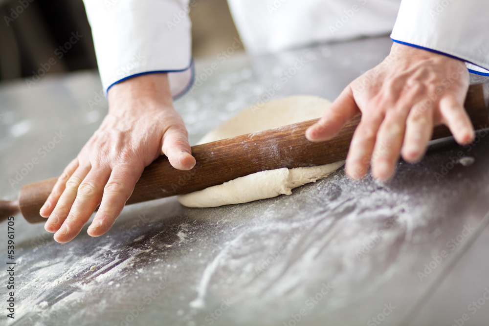 Chef preparing dough in a kitchen