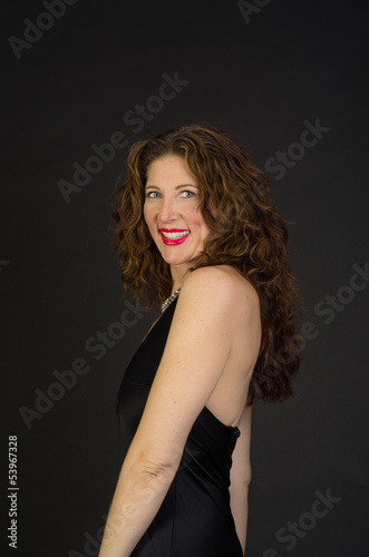 Attractive middle aged woman in black dress