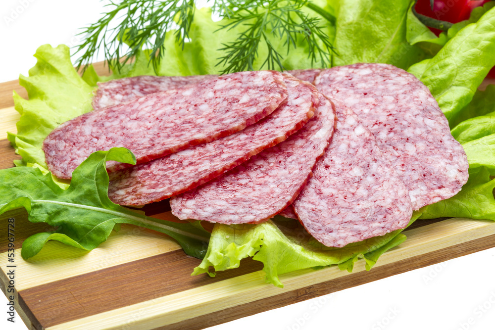 Fototapeta premium Sausages with salad and basil