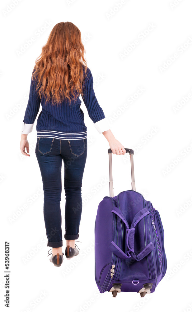 back view of walking woman with suitcase back view of walking woman with suitcase
