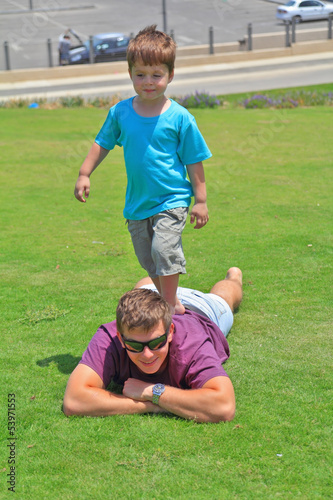 The boy having fun playing with his uncle