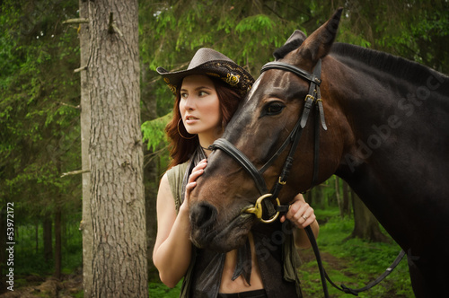 Cowgirl with brown horse