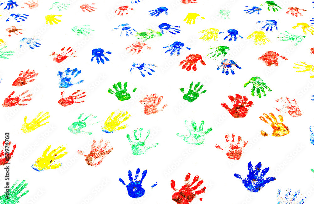 Multicolored handprints on the white wall
