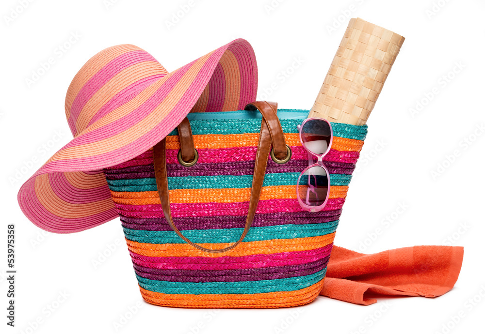 Colorful striped beach bag with a hat sun mat towel and sunglass - obrazy, fototapety, plakaty 