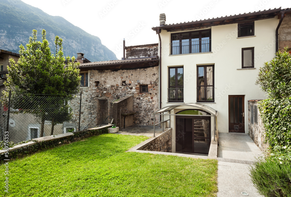 house in a typical village in Ticino, view from the garden