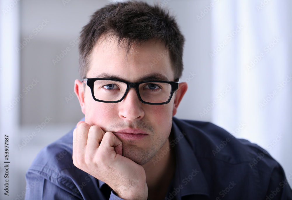 man with eyeglasses in office man with eyeglasses in office
