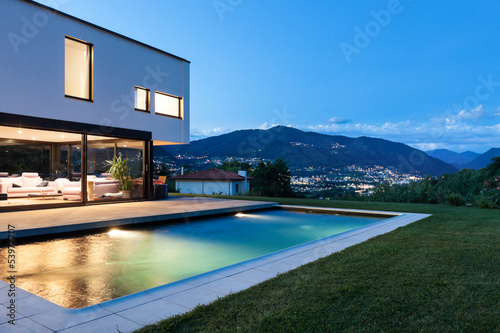 Modern villa with pool, night scene © alexandre zveiger