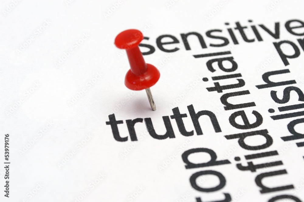 Push pin on Truth text Push pin on Truth text