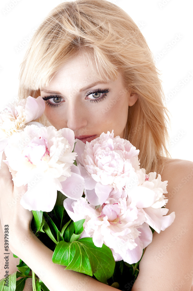 Sensual portrait of a blond woman with flowers on a white Sensual portrait of a blond woman with flowers on a white