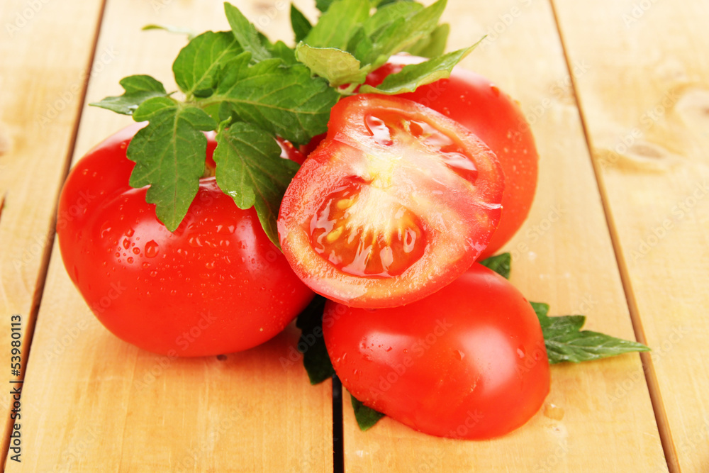 Fresh tomatoes on wooden table close-up Fresh tomatoes on wooden table close-up