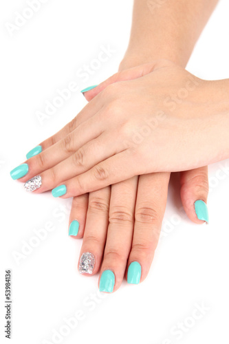 Beautiful woman hands with blue manicure isolated on white