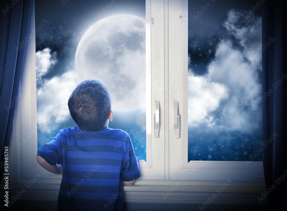 Obraz premium Boy Looking at Night Moon and Stars
