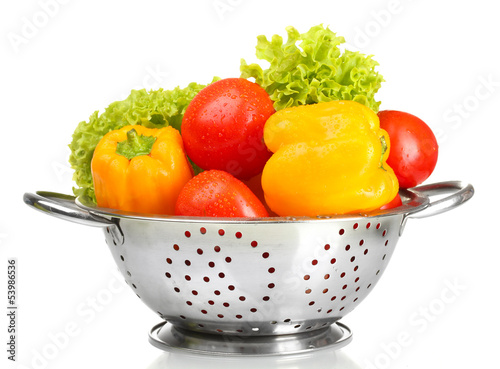fresh vegetables in silver colander isolated on white