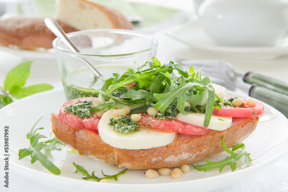 Ciabatta with tomato, mozzarella and rocket salad Ciabatta with tomato, mozzarella and rocket salad