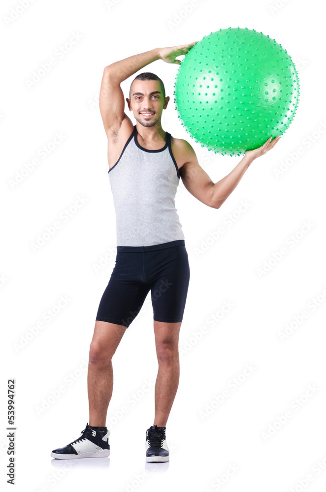 Man with swiss ball doing exercises on white Man with swiss ball doing exercises on white
