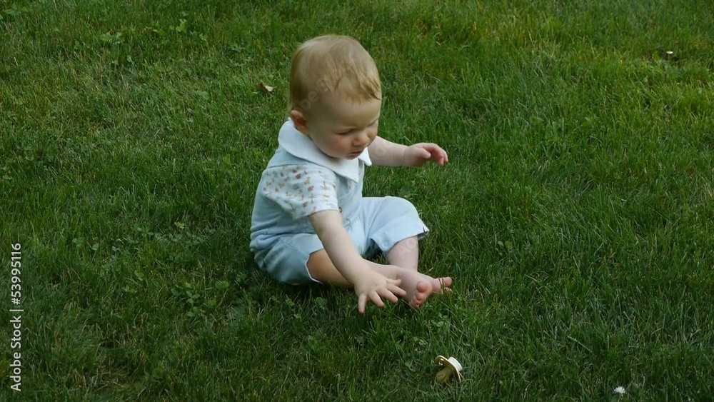 HD1080p25 Cute little baby playing with pacifier in the park HD1080p25 Cute little baby playing with pacifier in the park