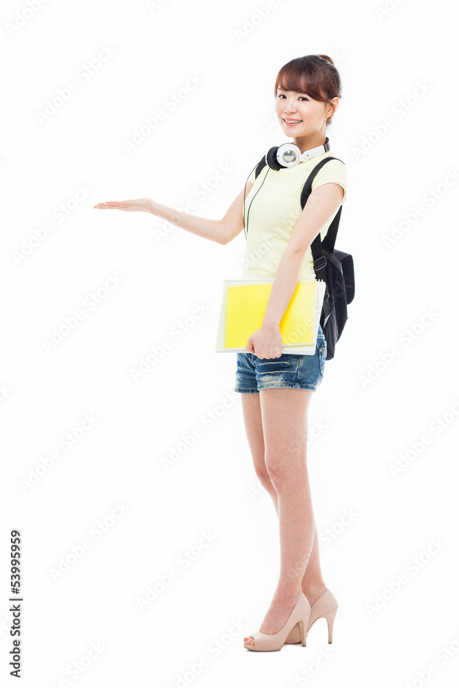 Young Asian student girl pointing side space Young Asian student girl pointing side space