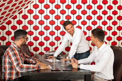 Men having happy discussion at meeting