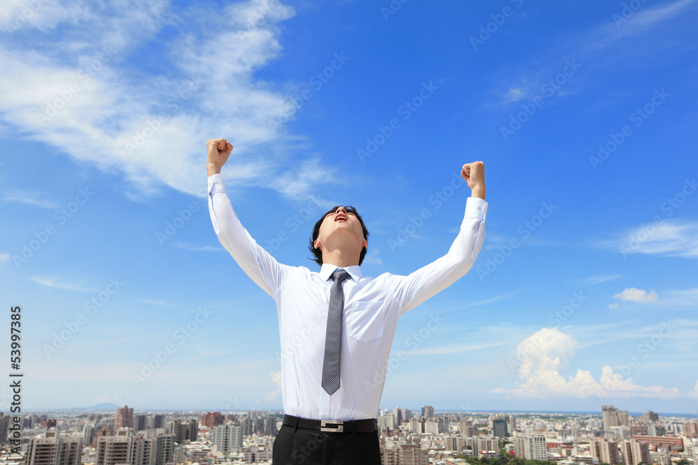 happy business man arise arms with cityscape happy business man arise arms with cityscape