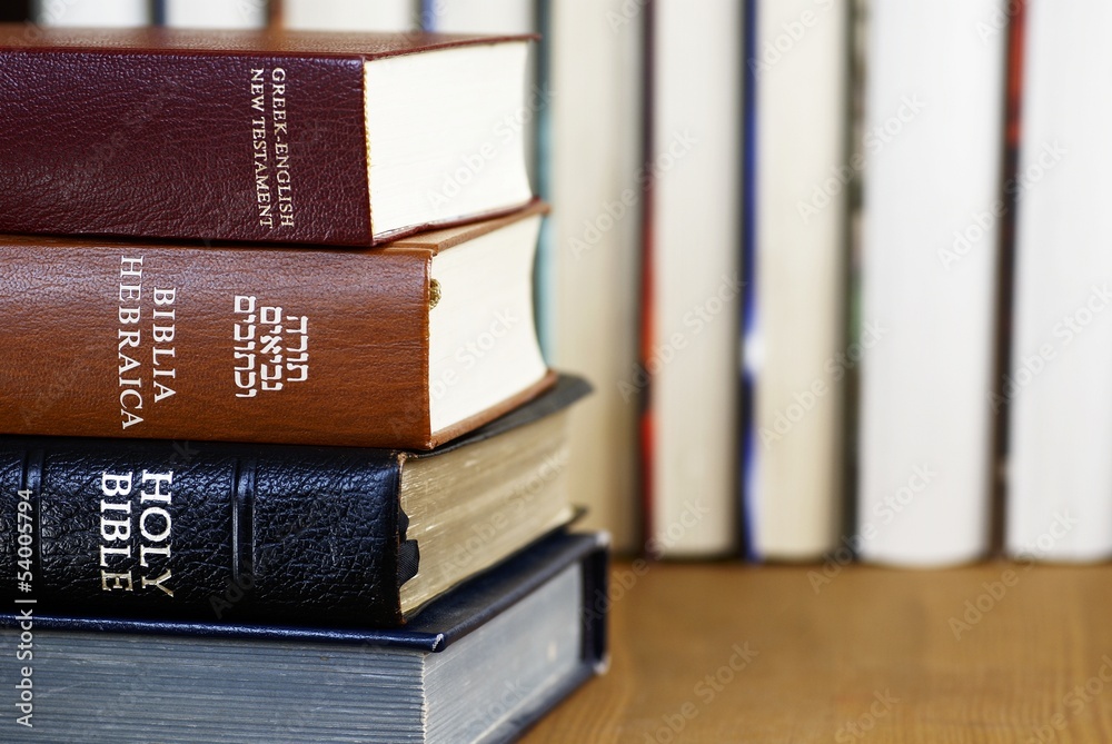 Fototapeta premium Holy Bible in different languages - english, hebrew and greek
