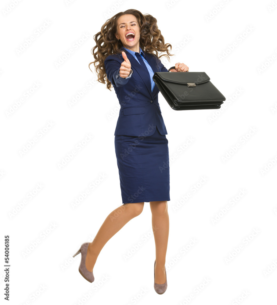 Full length portrait of business woman with briefcase jumping Full length portrait of business woman with briefcase jumping