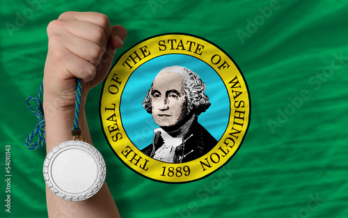 Silver medal for sport and  flag of american state of washington photo