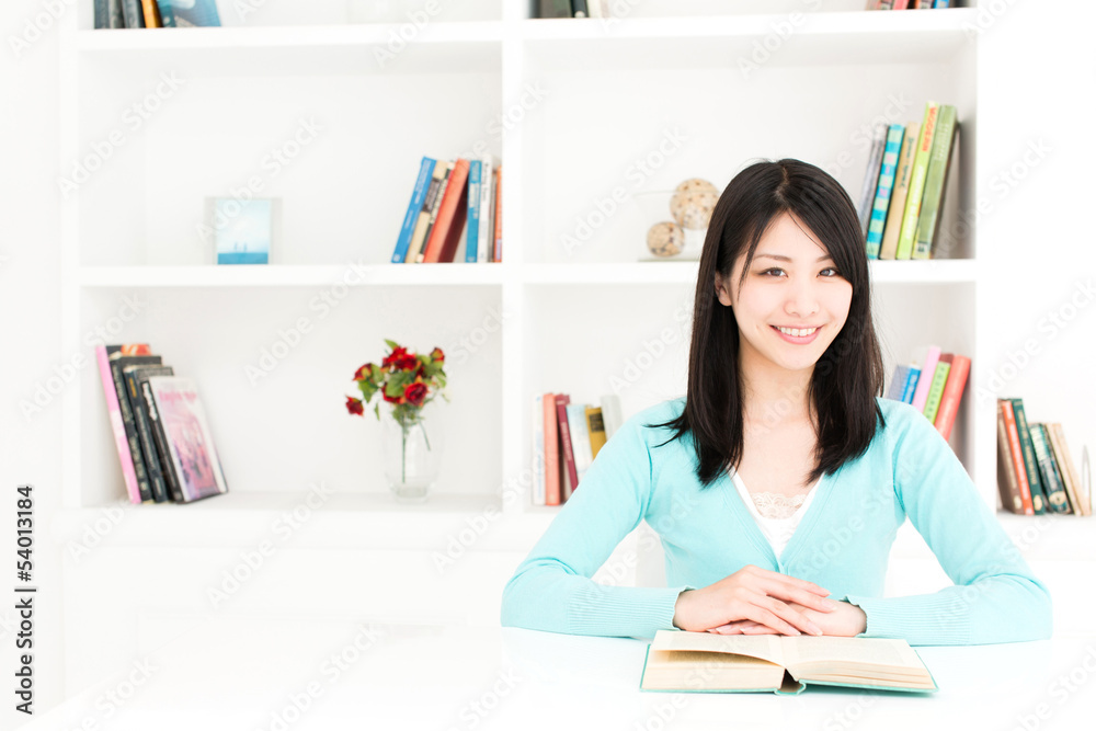 attractive asian woman reading book in the room attractive asian woman reading book in the room