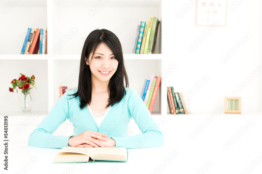 attractive asian woman reading book in the room attractive asian woman reading book in the room