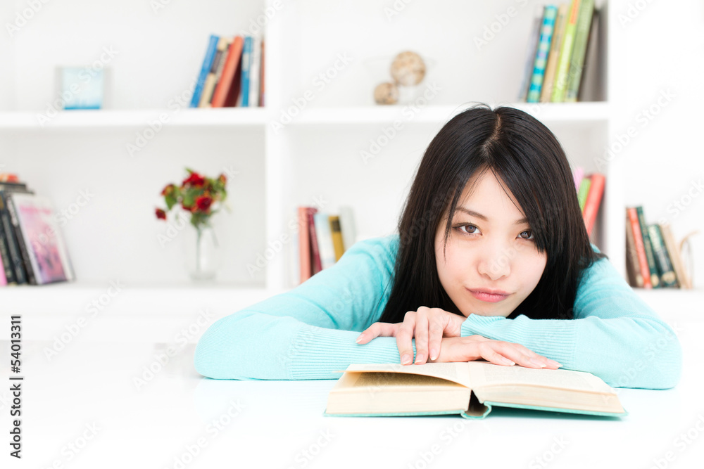 attractive asian woman reading book in the room attractive asian woman reading book in the room