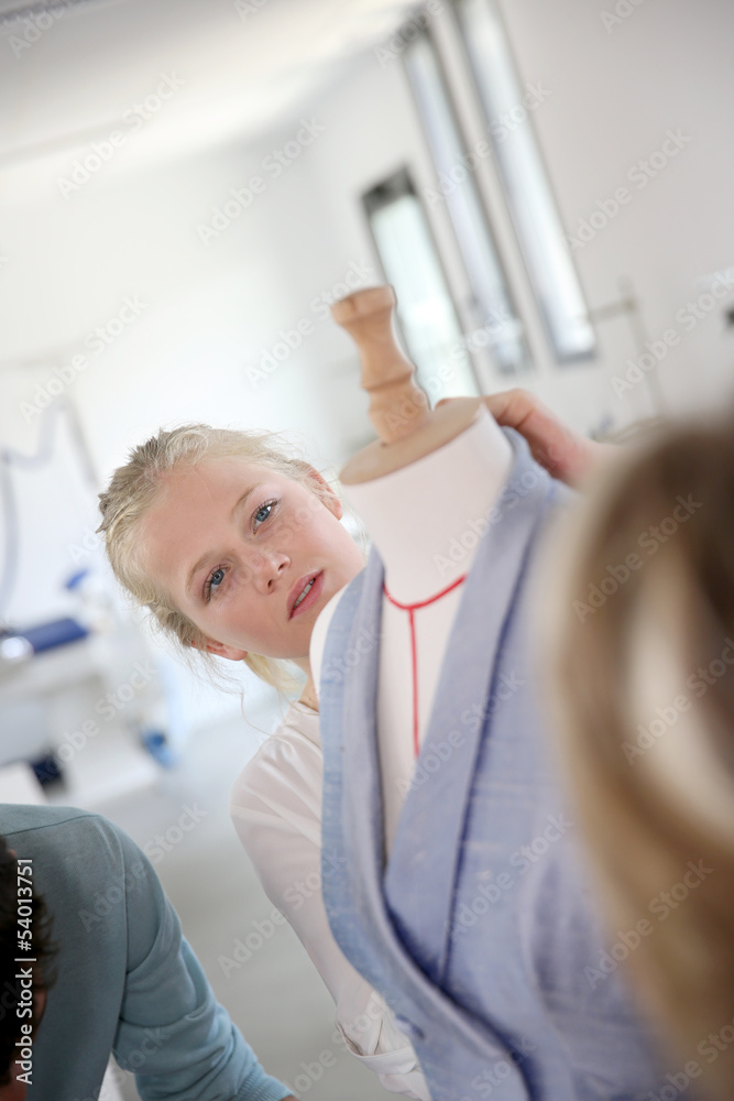 Fototapeta premium Student girl working on pattern