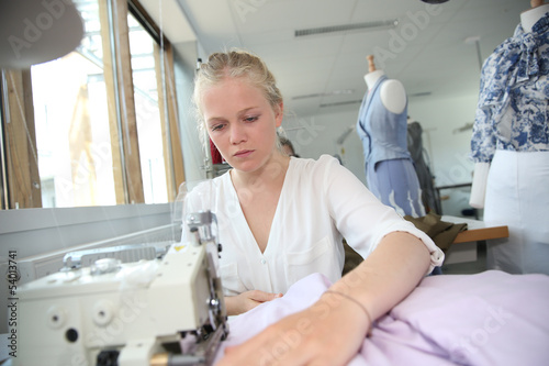 Young girl in sewing training course