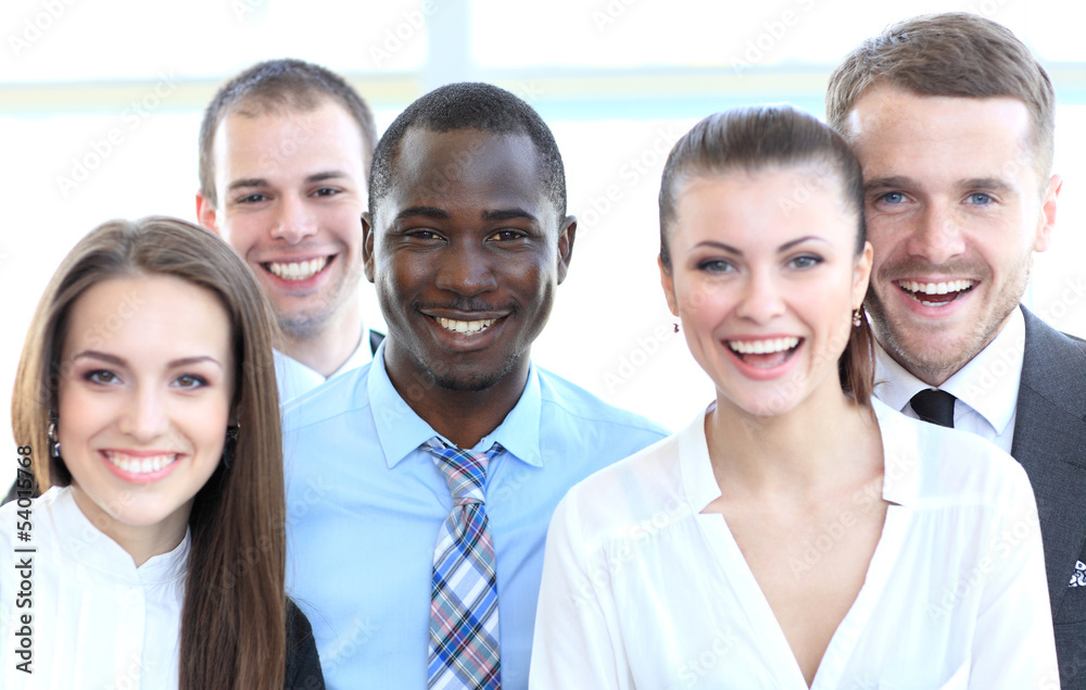 Closeup portrait of a successful business team laughing together Closeup portrait of a successful business team laughing together