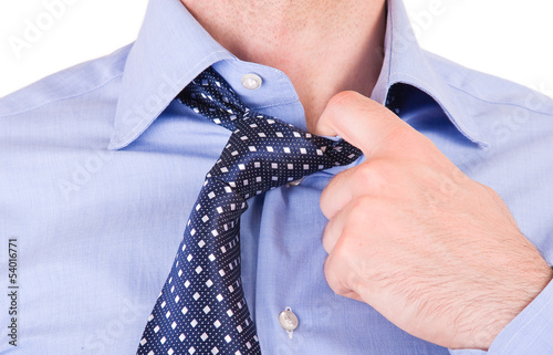 Businessman pulling his collar. photo