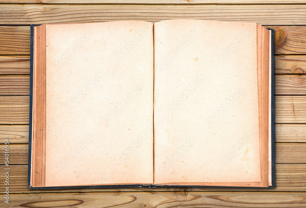 Fototapeta premium Open old vintage book on wooden background