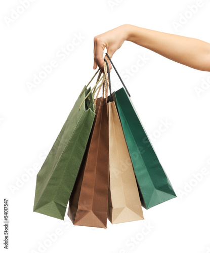 woman hands holding shopping bags