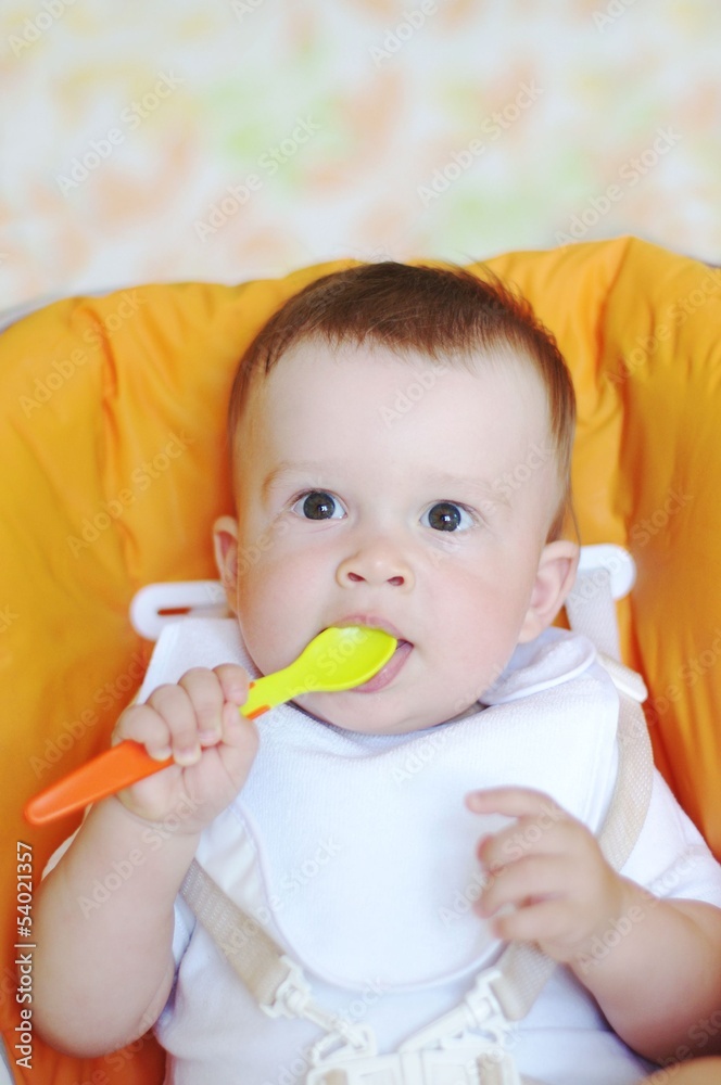 lovely baby age of 9 months with spoon lovely baby age of 9 months with spoon