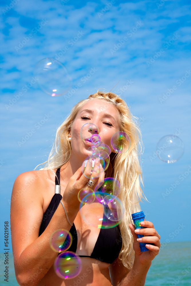Young blonde girl having fun on the beach Young blonde girl having fun on the beach