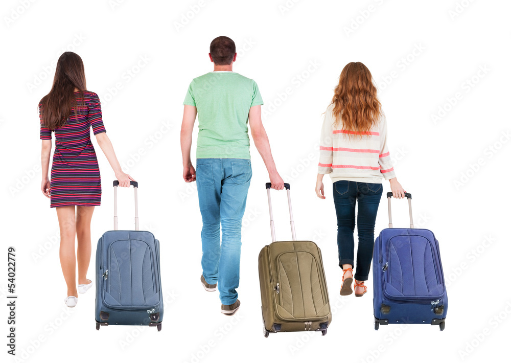 back view of walking group with suitcase back view of walking group with suitcase