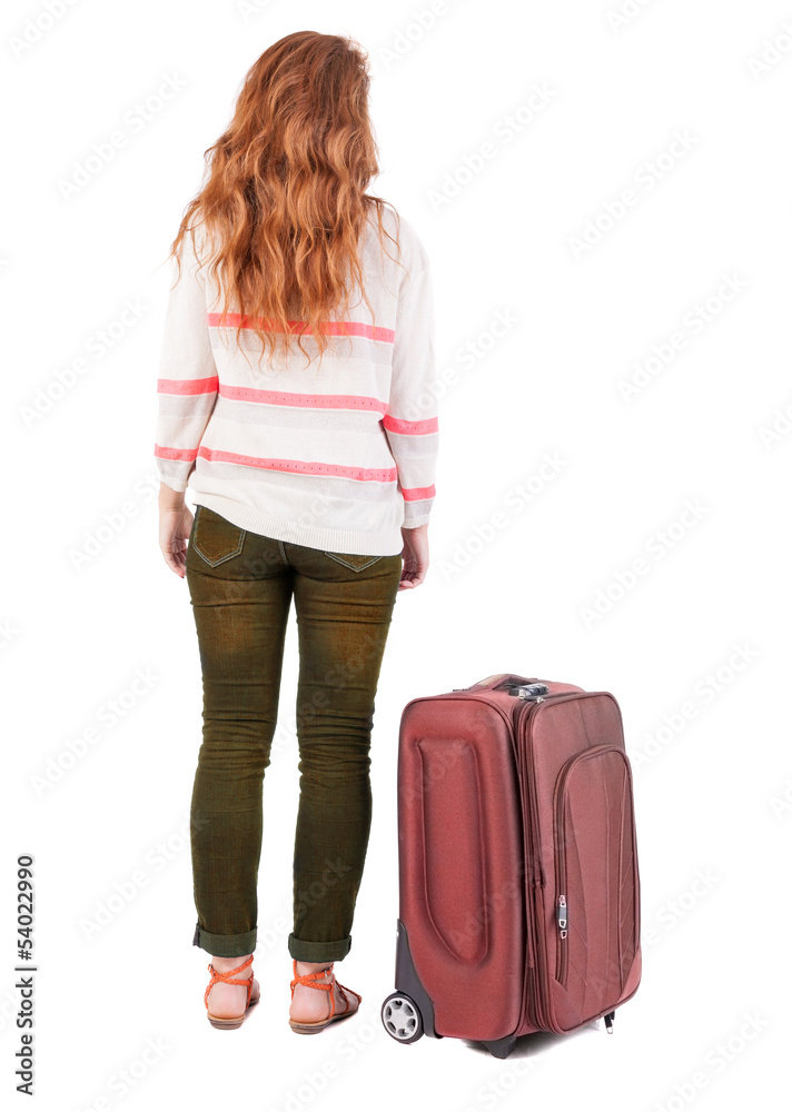 back view of walking woman with suitcase. back view of walking woman with suitcase.
