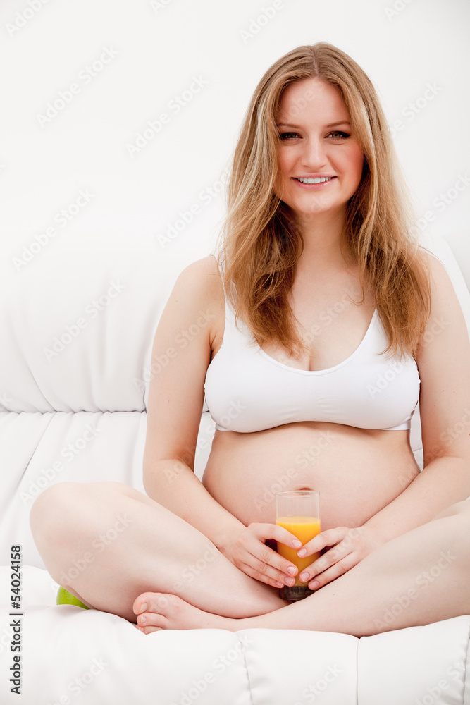 Naklejka premium Pregnant woman with juice
