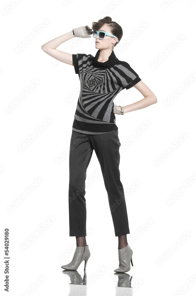 young fashion model posing in light background young fashion model posing in light background