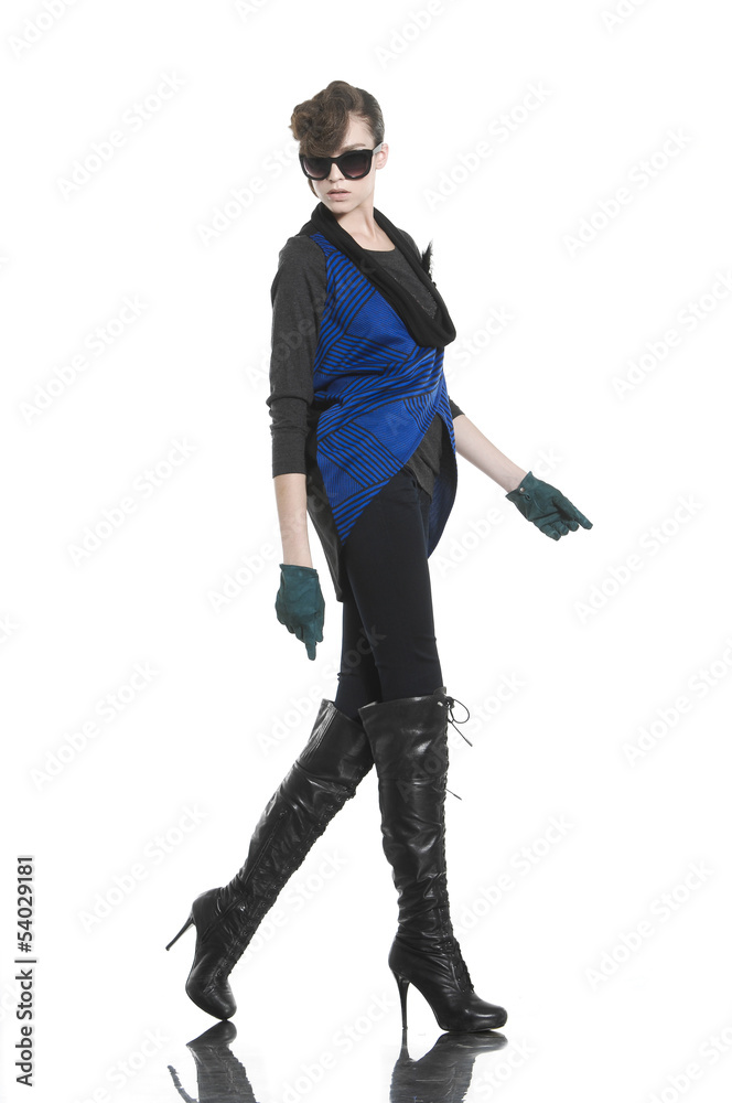 Attractive young fashion model posing in light background Attractive young fashion model posing in light background