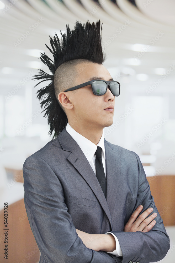 Well-dressed young man with Mohawk and sunglasses Well-dressed young man with Mohawk and sunglasses