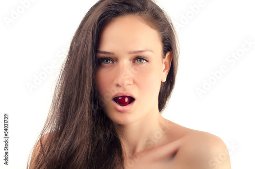 Beautiful woman posing with a cherry