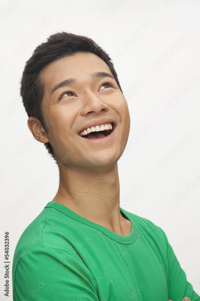 Portrait of young man smiling, white background Portrait of young man smiling, white background
