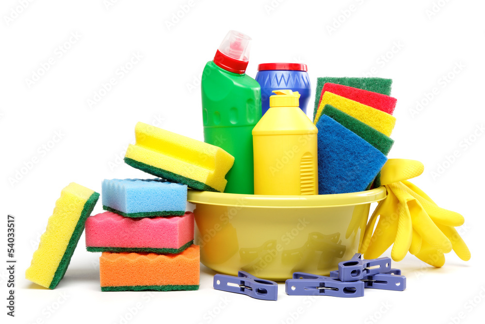 Detergent bottles, rubber gloves and cleaning sponge on a white Detergent bottles, rubber gloves and cleaning sponge on a white