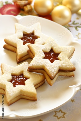 Christmas cookies on plate and Christmas ornaments. © Magdalena Kucova
