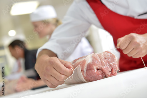 Closeup of meat roast being prepared by butcher